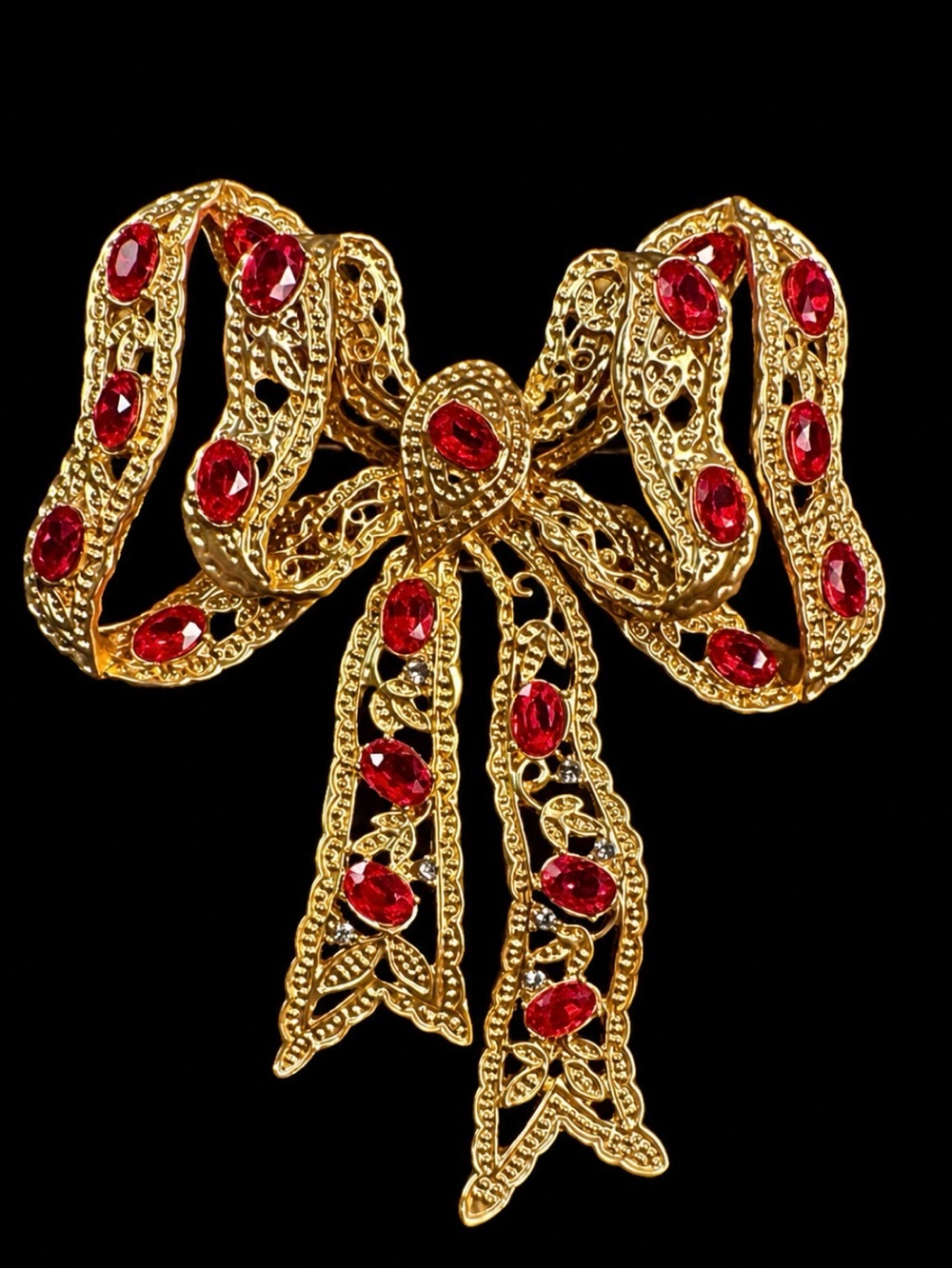 Gold-Tone Bow Brooch with Red Crystal Accents